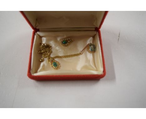 A 9ct gold pendant set with an aquamarine coloured stone, hung to a 9ct gold necklace; together with a a pair of opal set ear