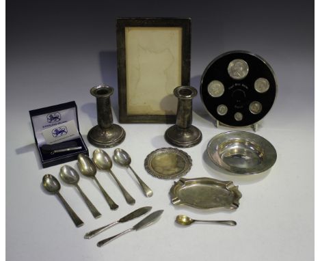 A collection of silver items, including a rectangular photograph frame (marks indistinct), height 20.3cm, a silver circular m
