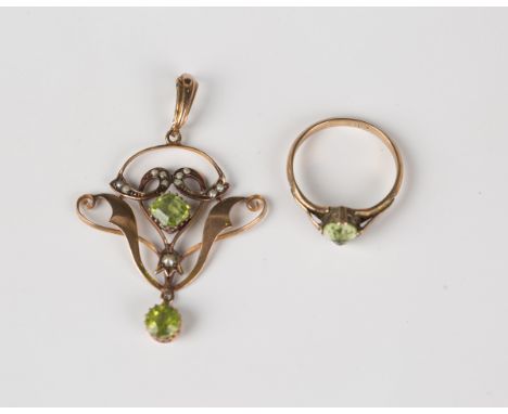 A gold, seed pearl and peridot pendant in an openwork design, detailed '9ct', length 4.5cm, and a gold ring, claw set with an