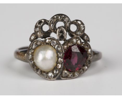 A Victorian gold and silver set, garnet, half-pearl and diamond ring, designed as two interlocking hearts, one set with an ov