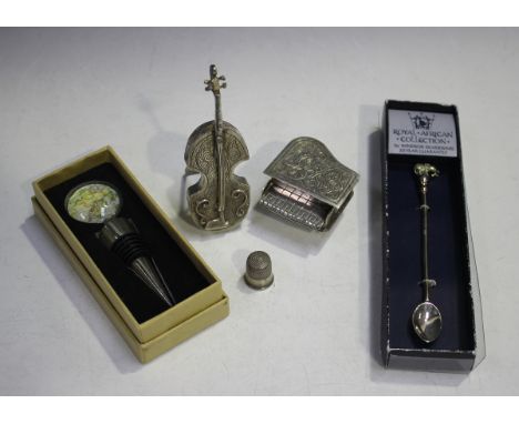 Two Egyptian silver models of musical instruments, comprising a piano, length 5.5cm and a cello, height 10.5cm, a sterling th