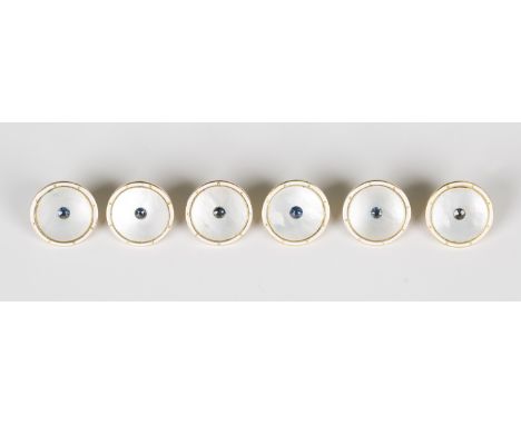 A set of six gold, sapphire, mother-of-pearl and white enamel dress buttons, each centred by a circular cut sapphire on a mot