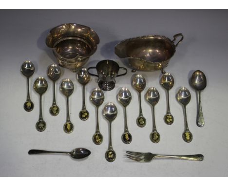 A set of twelve Elizabeth II silver teaspoons, each oval terminal decorated with a different flower, Sheffield 1974 by John P