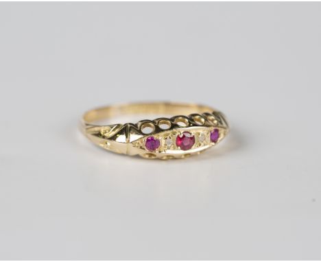 An 18ct gold, ruby and diamond five stone ring, mounted with three rubies and two diamonds in a boat shaped setting, Birmingh