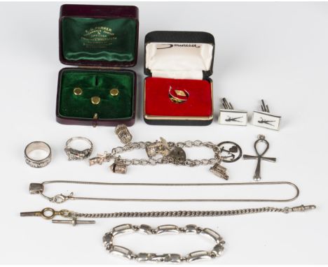 Three 9ct gold dress studs, weight 2.8g, with a case, a silver curblink charm bracelet, fitted with six charms, a silver Albe