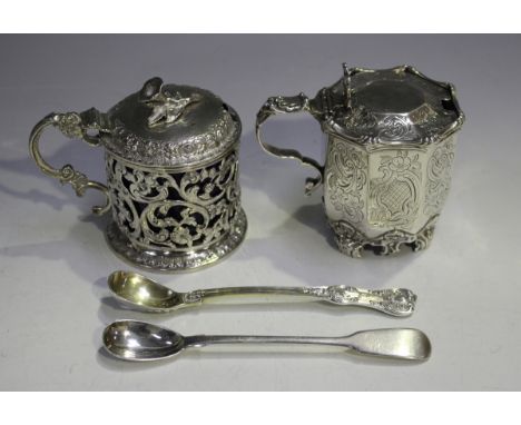 A Victorian silver cylindrical mustard with slightly domed hinged lid and flower finial above pierced and engraved foliate an