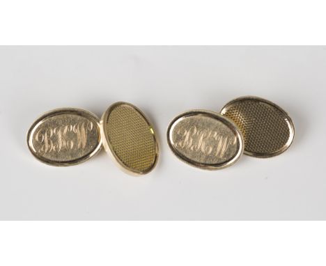 A pair of 9ct gold oval cufflinks, initial engraved to one side and engine turned to the other, Birmingham 1977, weight 17.1g