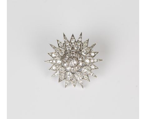 A Victorian diamond brooch, designed as a starburst, mounted with cushion and rose cut diamonds, the principal diamond mounte