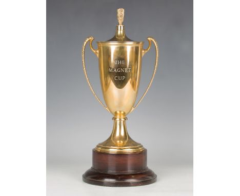 An Elizabeth II 9ct gold two-handled trophy cup and cover, the tapered body engraved 'The Magnet Cup', on a spreading circula