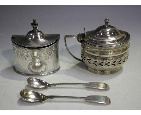 A George III silver oval mustard, the tapering hinged lid with urn finial above engraved floral medallion and foliate wreath 