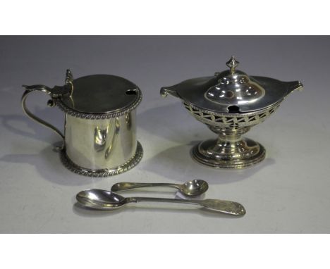 A late Victorian silver cylindrical mustard, the hinged lid with scroll thumbpiece above gadrooned rims, Sheffield 1895 by At