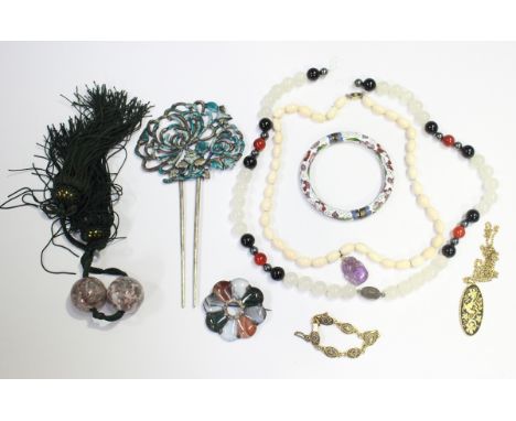 A group of costume jewellery, including a hardstone set brooch, a green hardstone and enamel bead necklace and an enamelled h