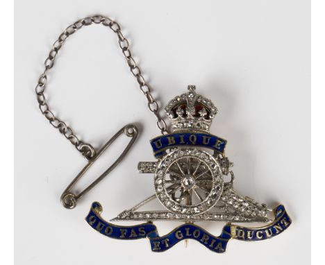 A gold, diamond and enamelled Royal Artillery brooch, fitted with a safety chain, unmarked, weight 6.2g, width 3.5cm.Buyer’s 