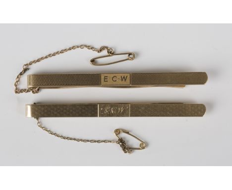 A 9ct gold tie slide with engine turned decoration, initial engraved, Birmingham 1961, length 7.1cm, and another 9ct gold tie