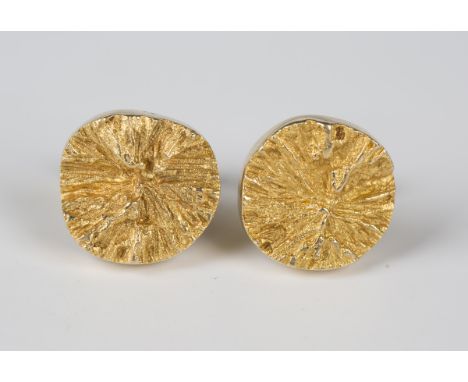 A pair of Finnish Lapponia 18ct gold cufflinks, designed by Bjorn Weikstrom, each formed as a heavily textured circular disc,