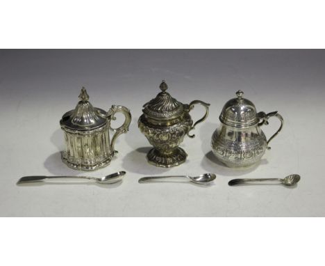 A Victorian silver mustard of tapering low-bellied form with domed hinged lid and knop finial, decorated in relief with signs