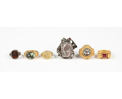 Seven rings of medieval inspired design, comprising two intaglio rings, a signet ring, three gem set rings and a rose quartz 