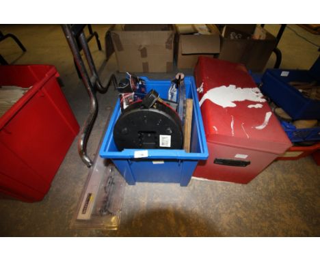 Red metal toolbox including tools along with another box of tools