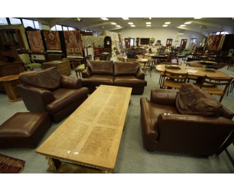 Leather two seater sofa bed, two chairs and footstool