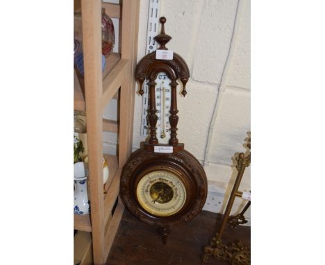 LATE VICTORIAN ANEROID BAROMETER AND THERMOMETER COMBINATION IN FLORAL CARVED FRAME