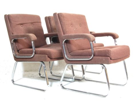 A set of three vintage Gordon Russell style easy chairs / armchairs. The chair having brown fabric upholstery and button back