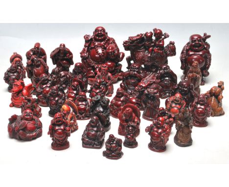 A&nbsp; large collection of Chinese resin cast cinnabar coloured netsuke and okimono's to include Buddha in various form, dei