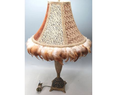 A mid century 1950's clasic brass and amber glass reservoir table lamp / light. The lamp complete with original feather adorn