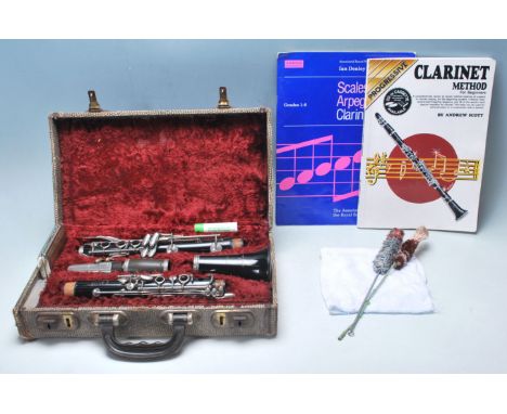 A vintage clarinet by Boosey &amp; Hawkes London - Regent. The Clarinet having an ebonised body with metal keys and stamped B