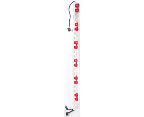 A single vintage fairground ride / amusement park light strip board having twenty-four red and clear plastic shaped shades ru