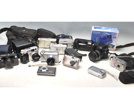 A large collection of digital cameras and 35mm to include; FinePix S5500, Polaroid IX828, OlympusC-765 ultra zoom, Power Shot