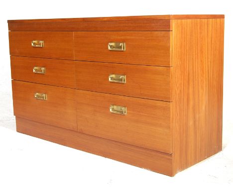 A vintage 20th century teak wood low six drawers chest of drawers having square brass swing handles with brass back plates ra