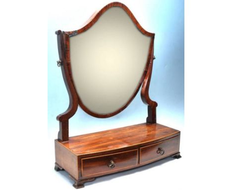 A 19th century Georgian mahogany shield mirror / toilet mirror, &nbsp;having a bevelled glass mirror atop shape in a shield a