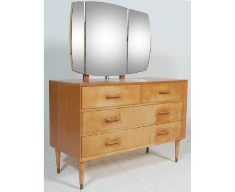 A vintage retro mid 20th Century oak dressing table chest of drawers having a mounted triptych mirror to the top, the chest h