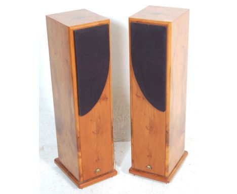 A pair of retro vintage floor standing hi-fi speakers by Castle. The speakers are housed in fruitwood veneer cabinets raised 