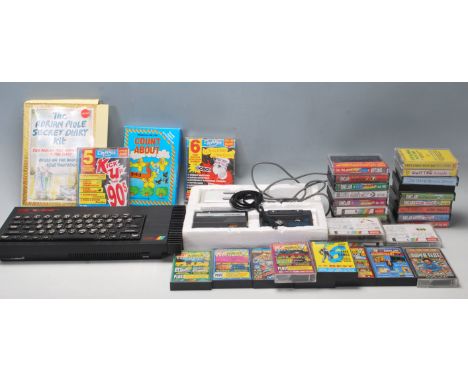 An original vintage Sinclair made ZX Spectrum 128K games console, along with a large collection of assorted cassette games - 