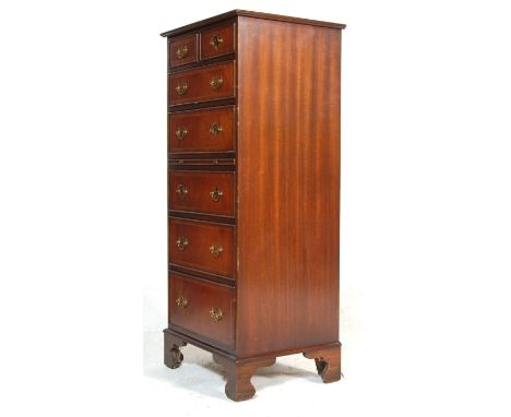 A tall antique style Regency revival pedestal mahogany inlaid chest of drawers. Raised on bracket feet with an upright bank o