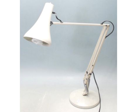 A vintage 20th Century Herbert Terry Anglepoise industrial desk lamp finished in a white enamel colourway. Raised on circular