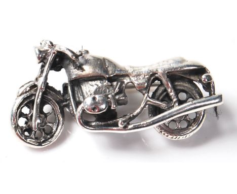 A stamped 925 silver brooch pin in the form of a Harley Davidson chopper motorbike. Measures 34mm in length. Weighs 9.69 gram