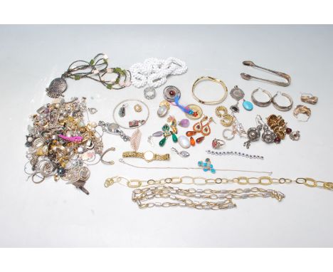 A collection of vintage costume jewellery to include a wide selection of clip on earrings, a Fope yellow metal chain necklace