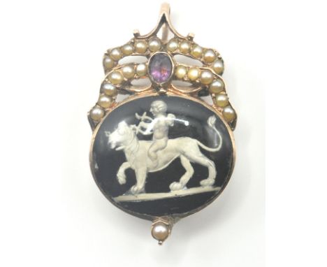A Georgian gold locket pendant having a an oval sulphide panel with a black and white lion and cherub motif associated with '