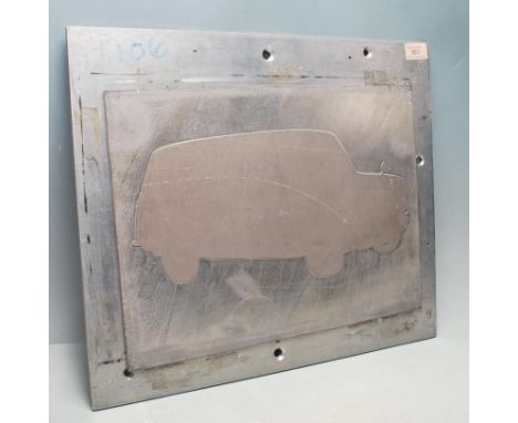 A vintage industrial salvage factory mid 20th century cast aluminium advertising poster printing plaque having a Mini Travell