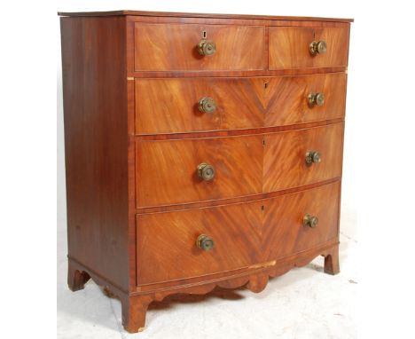 A 19th Century Victorian flame mahogany bow fronted two over three chest of drawers having brass knob handles with locks to e