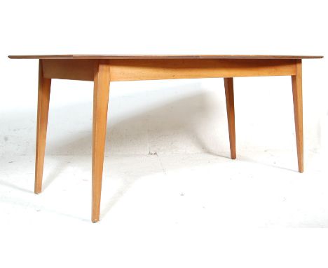 A vintage retro teak 1970's wood dining table of Danish influence having an angular design&nbsp; rectangular table top&nbsp; 