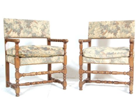 A good pair of early 20th century provincial French oak fauteuils - armchairs. Raised on bobbin turned legs with stretchers h