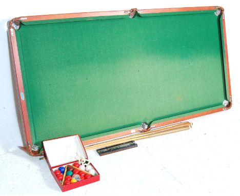 A vintage late 20th century Petworth House Ltd table top pool table /&nbsp;snooker table. The table complete with three cues 