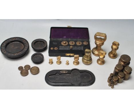 A collection of vintage brass scale weights to include “ The King - 500g, 2 x 200g, 100g, 50g, 2x 20g, 10g, 5g, bell brass we