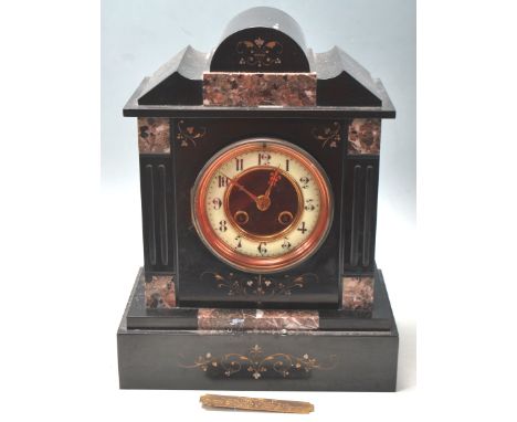 A Victorian 19th century slate and marble mantel clock by Marti &amp; Co, Paris. Inset brass &nbsp;8 day movement striking on