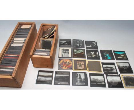 A large collection of antique late 19th century early 20th century glass magic lantern glass slides. Approximately 150 in tot