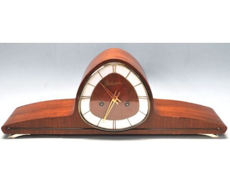 A vintage mid century Art Deco style Belcanto&nbsp; German mantel clock. The clock&nbsp; having unusual triangle shaped face 