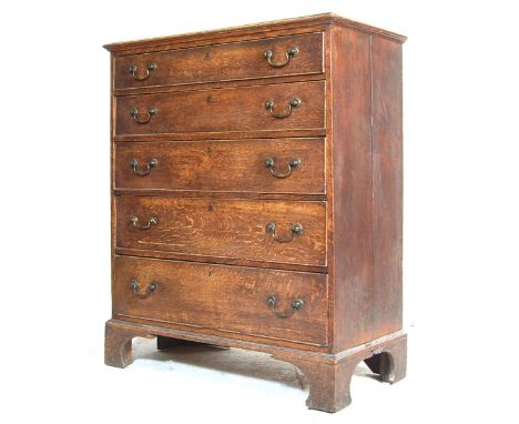 An antique George III 19th Century North Country solid oak upright chest of drawers having a flared top over 5 spacious gradu